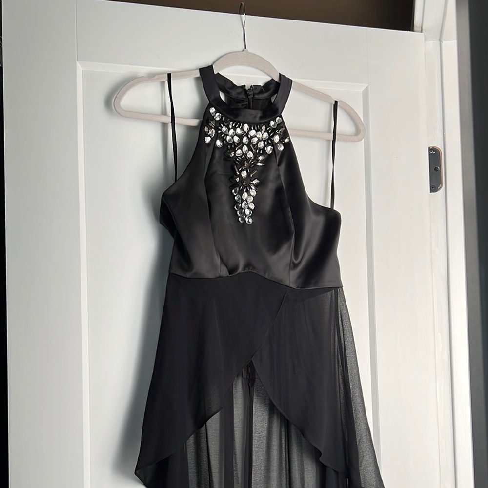 Elegant Black BeBe Sleeveless Racer Back Hi-Lo Top with Embellishments